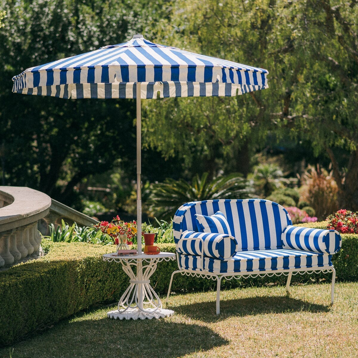 The Al Fresco Love Seat in Crew Mediterranean Blue Stripe | Antique White Frame - Image 2