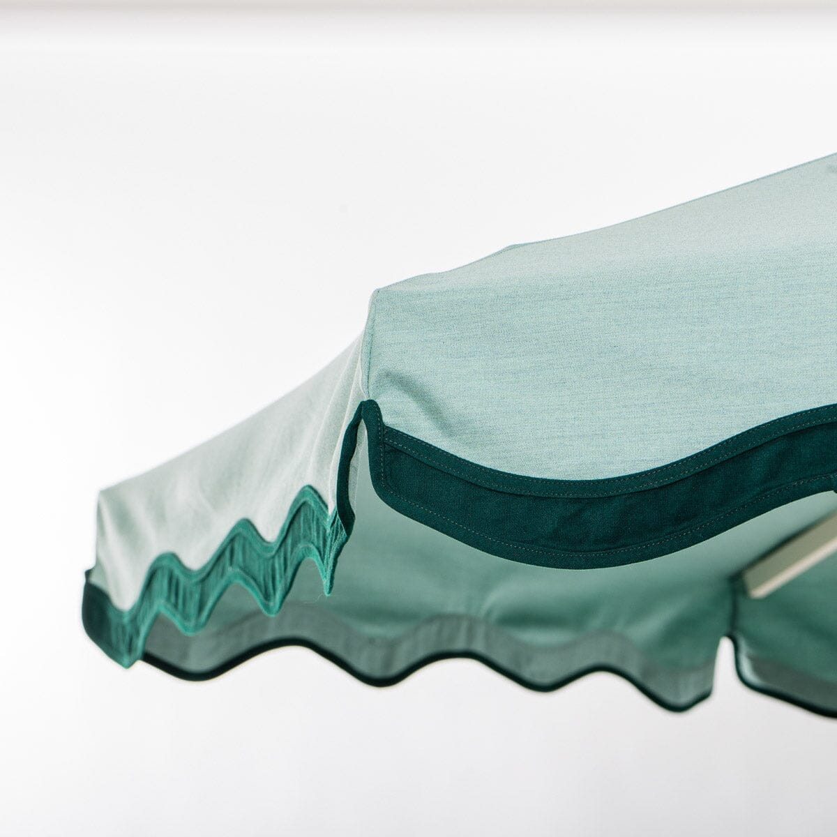 The Resort Market Umbrella in Rivie Green | 10' Antique White Frame - Image 6